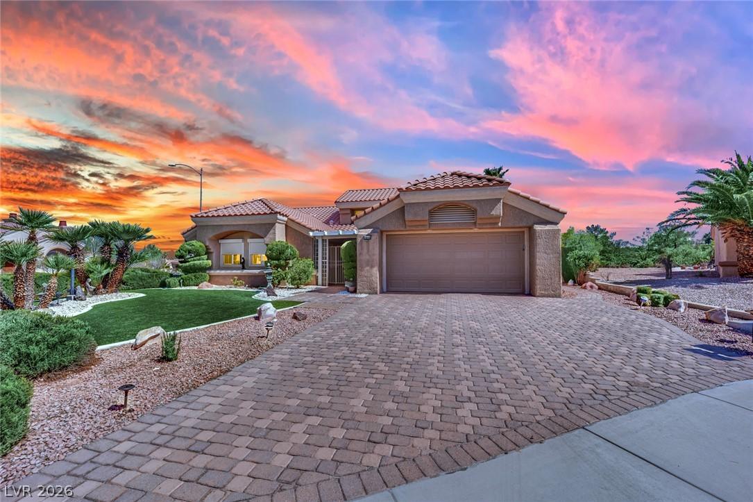 Image 2: A terracotta-tiled roof and desert landscaping cre
