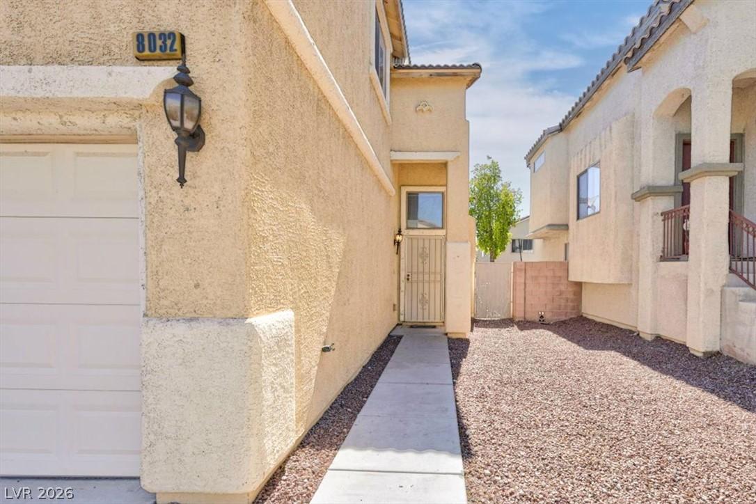 Image 4: A welcoming walkway leads to a secure front entry,