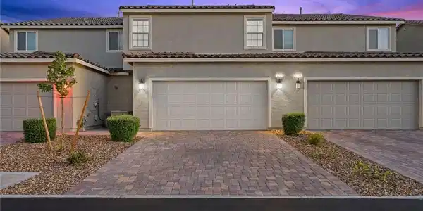 Image 2: An attractive paved driveway leads to the spacious