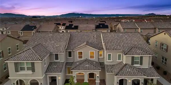 Image 3: Dusk skies frame this contemporary multi-level res