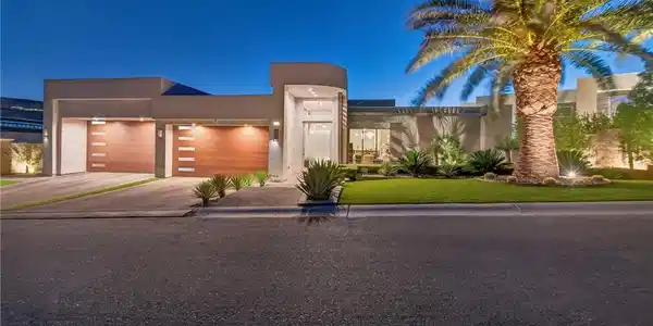 Image 3: A modern architectural entrance and landscaping.