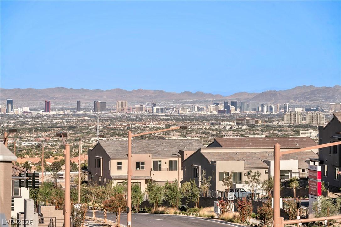 Image 2: City lights twinkle across the desert landscape, o