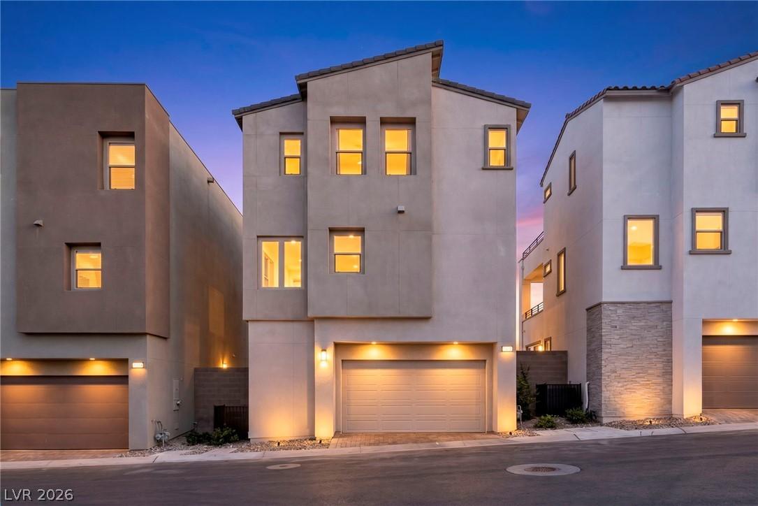 Image 3: The striking modern facade with clean lines makes