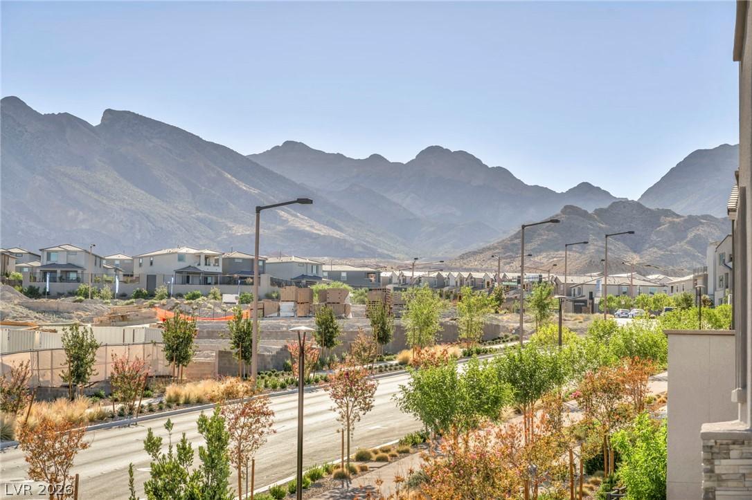 Image 4: Distant mountains frame a serene neighborhood with