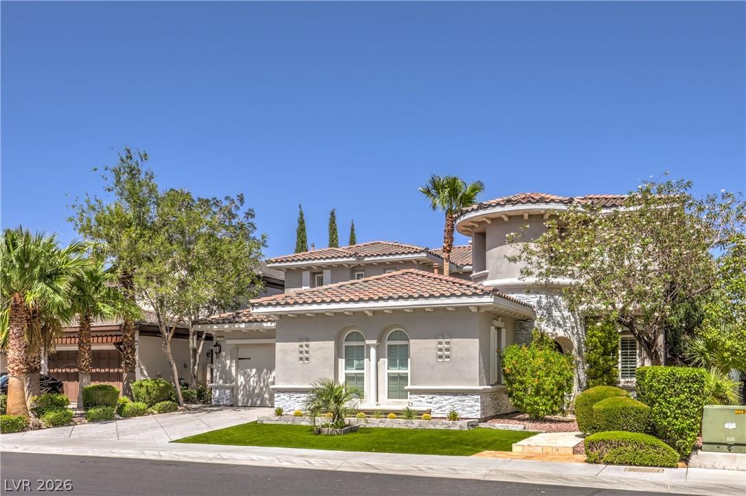 Image 2: A terracotta tile roof crowns this graceful stucco