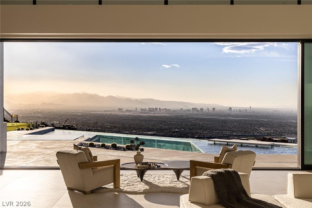 Image 2: Floor-to-ceiling glass reveals commanding desert a