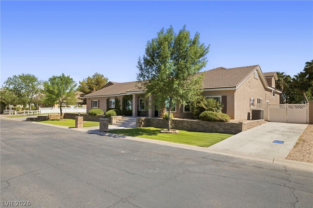 Image 2: A gracefully designed home with mature landscaping