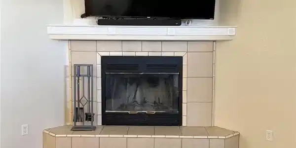 Image 4: This living room corner showcases a cozy fireplace