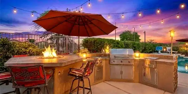 Image 4: An inviting covered patio with a dining area and a