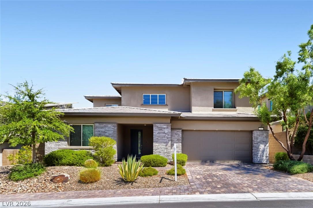 Image 3: Modern desert home with elegant stone accents and