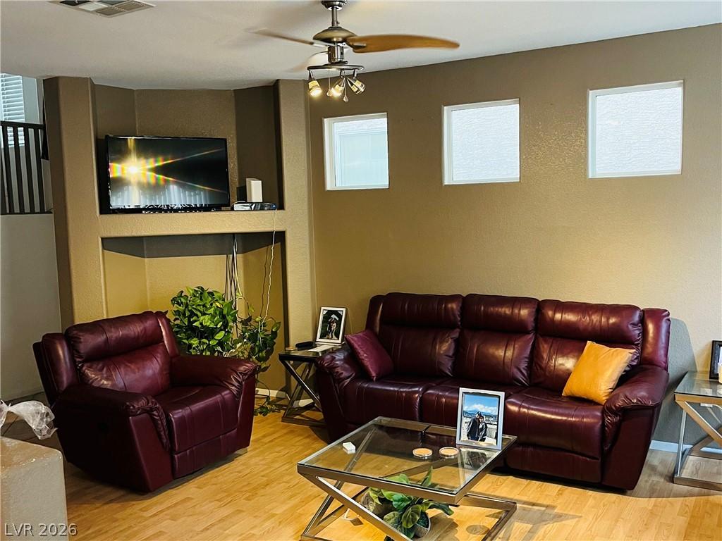 Image 4: A welcoming living area showcases a built-in media
