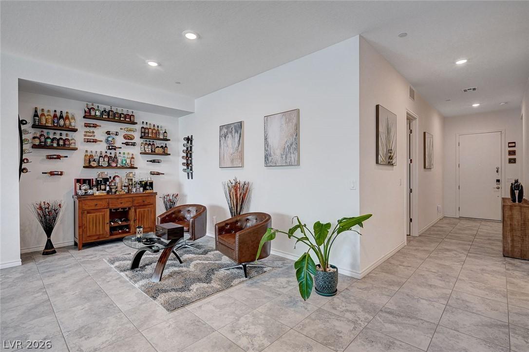 Image 3: This versatile space features a dedicated bar area