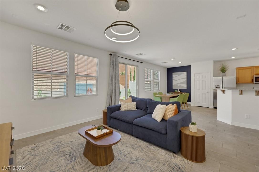 Image 4: This inviting space features an open concept livin