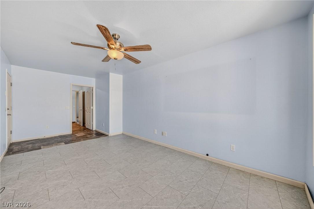Image 2: A versatile living area features tiled flooring, l