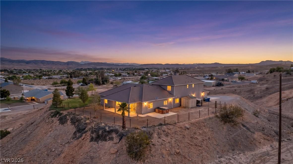 Image 2: Perched on a desert hillside, this home offers tra