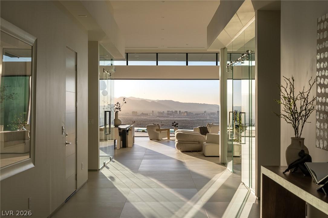 Image 3: Floor-to-ceiling windows showcase an awe-inspiring