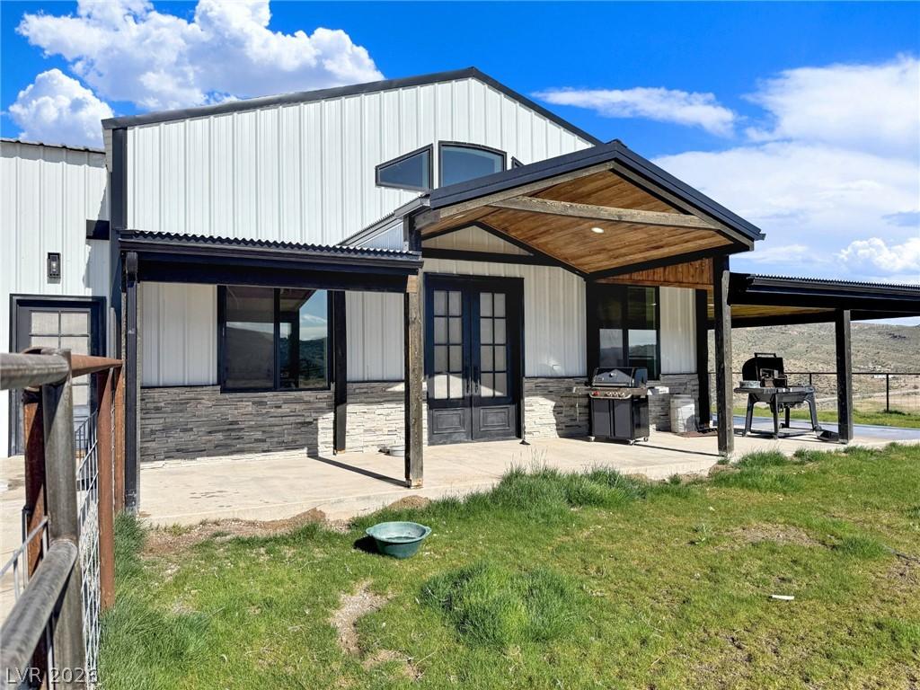 Image 2: A modern facade with corrugated siding offers a we
