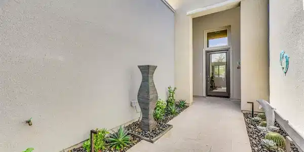 Image 2: An elevated private courtyard welcomes you into th