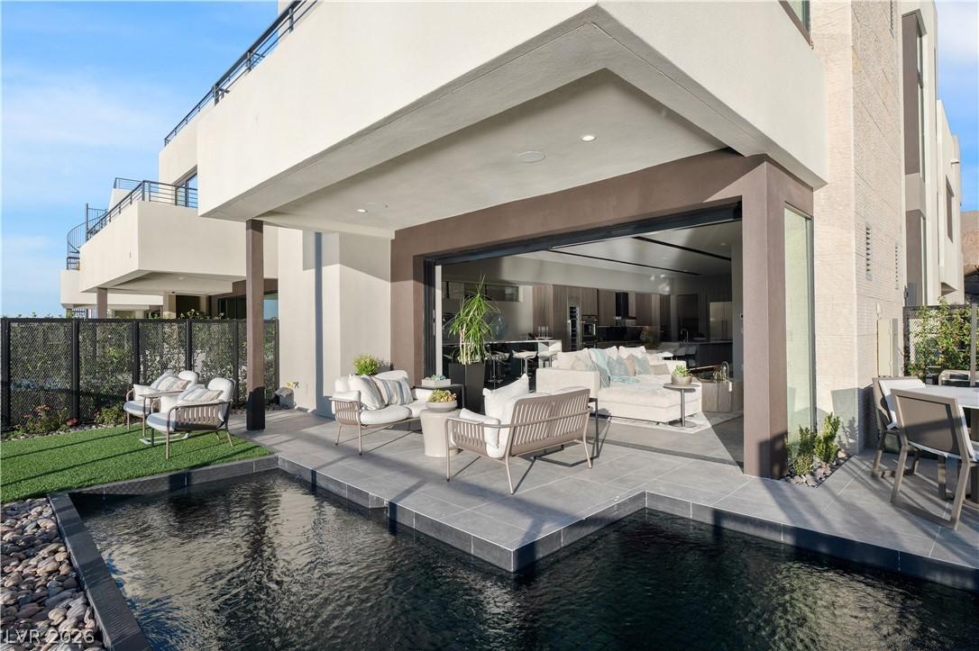 Image 1: An inviting outdoor living area features a private