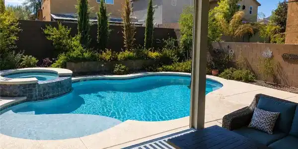 Image 3: A sparkling swimming pool and raised spa anchor th