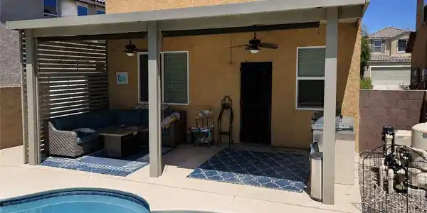 Image 4: An inviting covered patio opens directly to a refr
