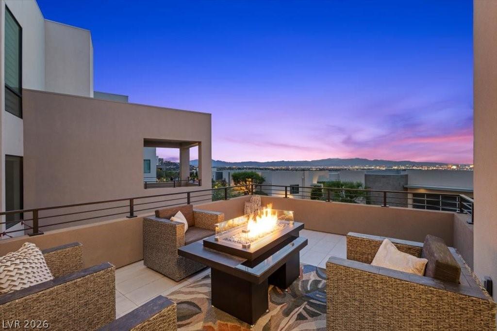 Image 4: BALCONY OFF LIVING ROOM NIGHT STRIP VIEW