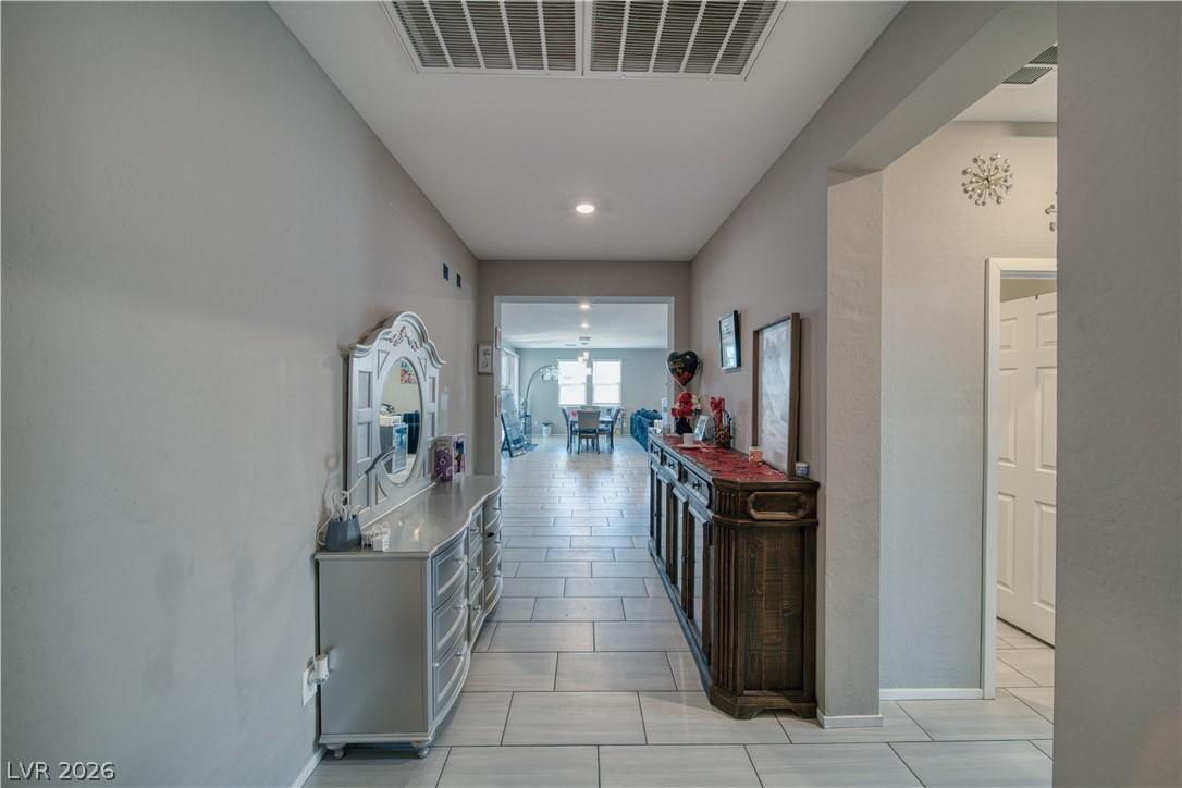 Image 4: A gracefully designed entry with tiled floors offe