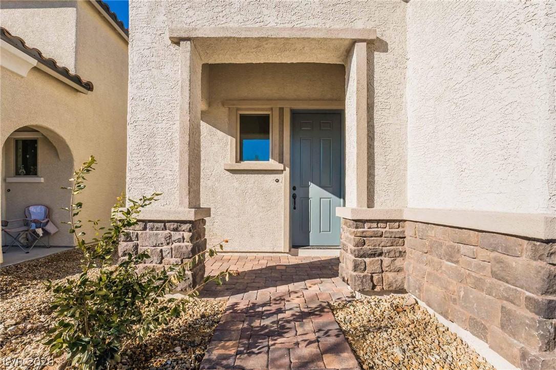 Image 3: A welcoming brick paver walkway leads to the invit