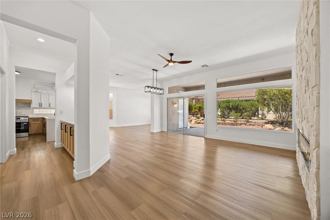Image 4: An open-concept living area flows seamlessly with