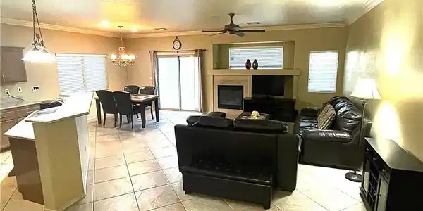 Image 4: Living room featuring crown molding, a chandelier,