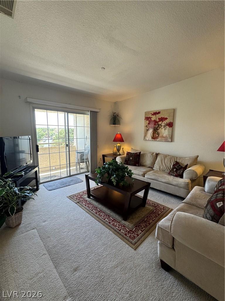 Image 3: This living area offers comfort and ample natural