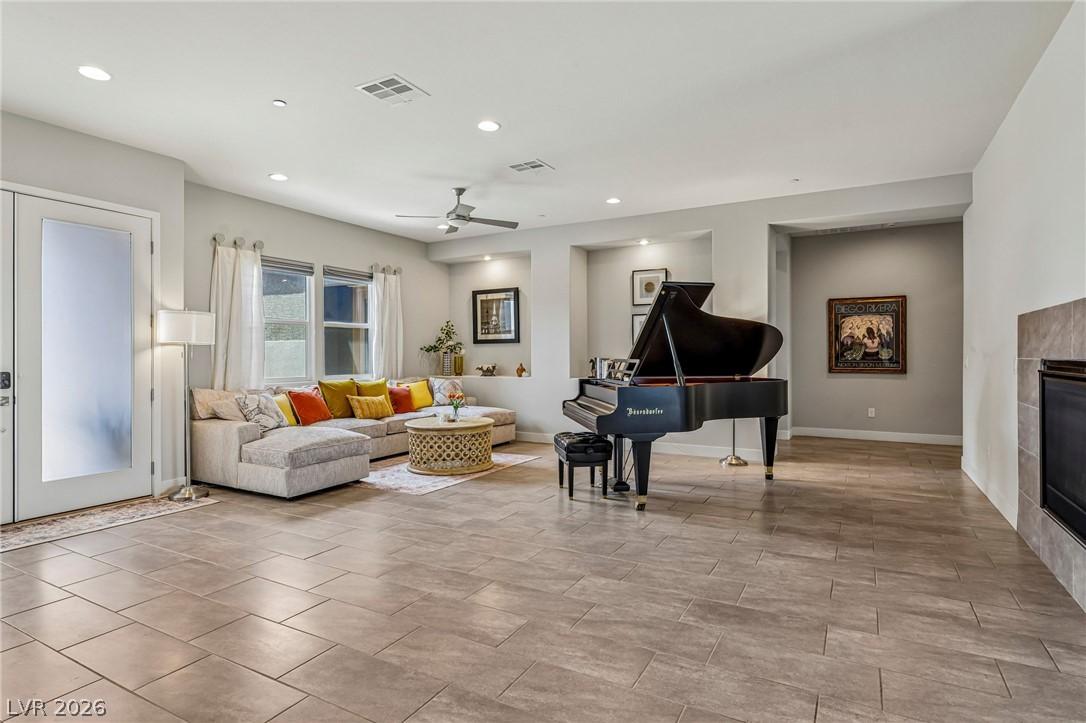 Image 2: A refined living space showcasing a grand piano an