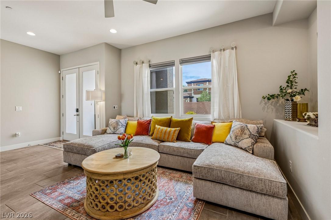 Image 3: Recessed lighting illuminates this inviting living