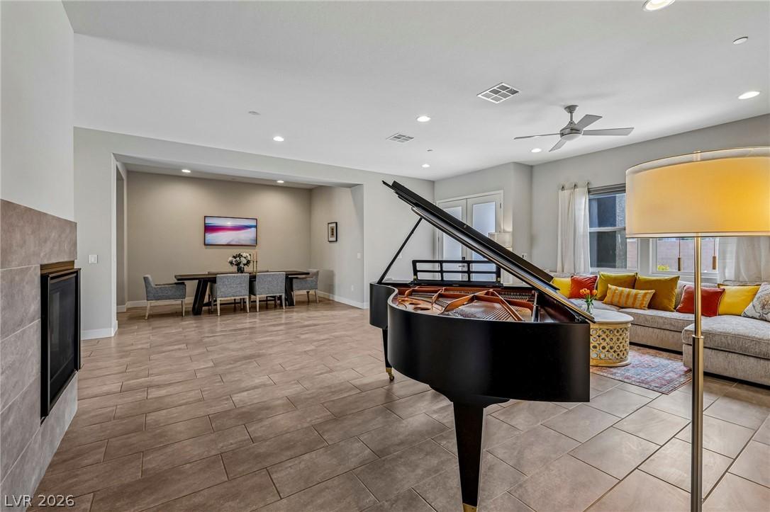 Image 4: A grand piano takes center stage in this spacious,
