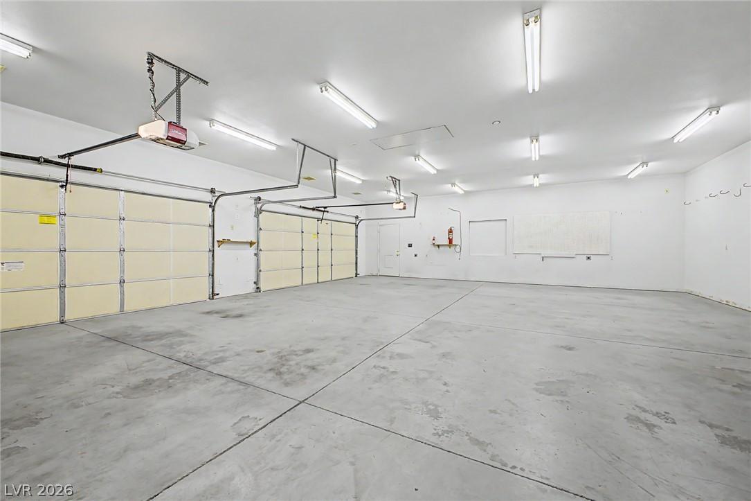 Image 4: A spacious, detached, 7-car garage featuring multi