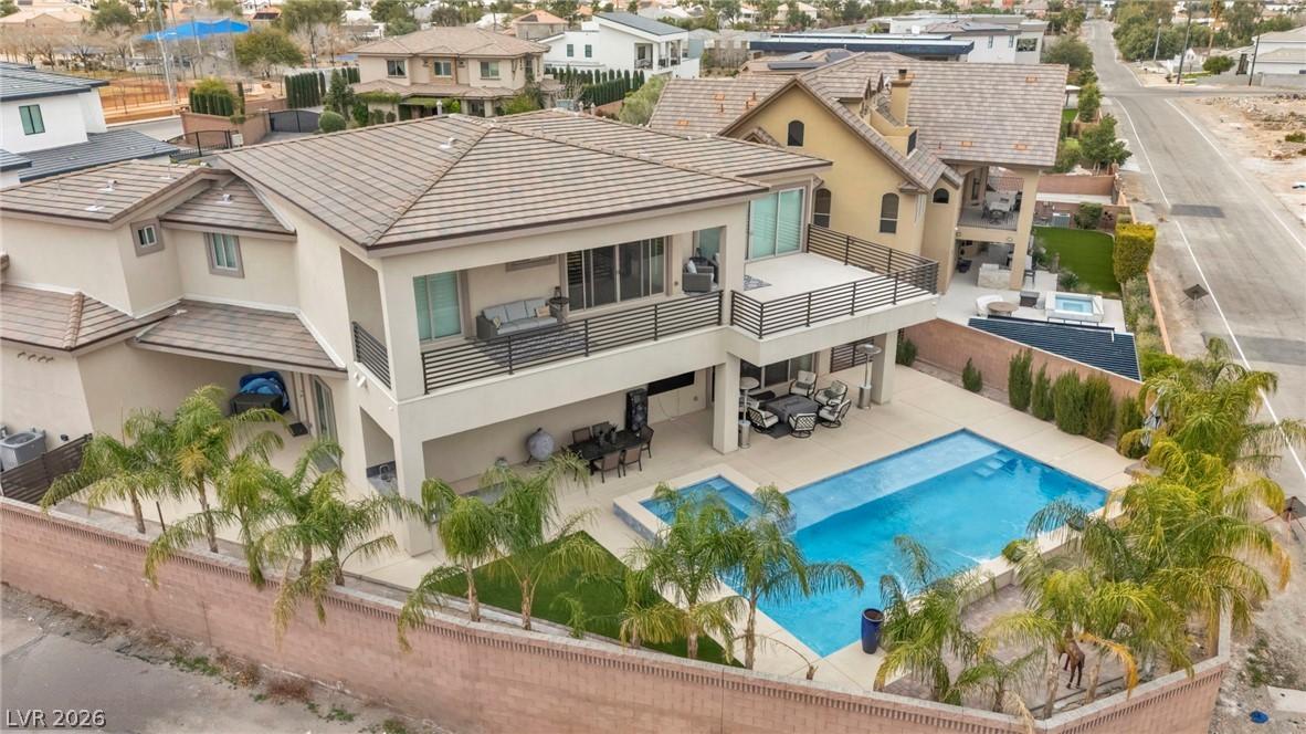 Image 3: Back of property featuring outdoor dining space, a