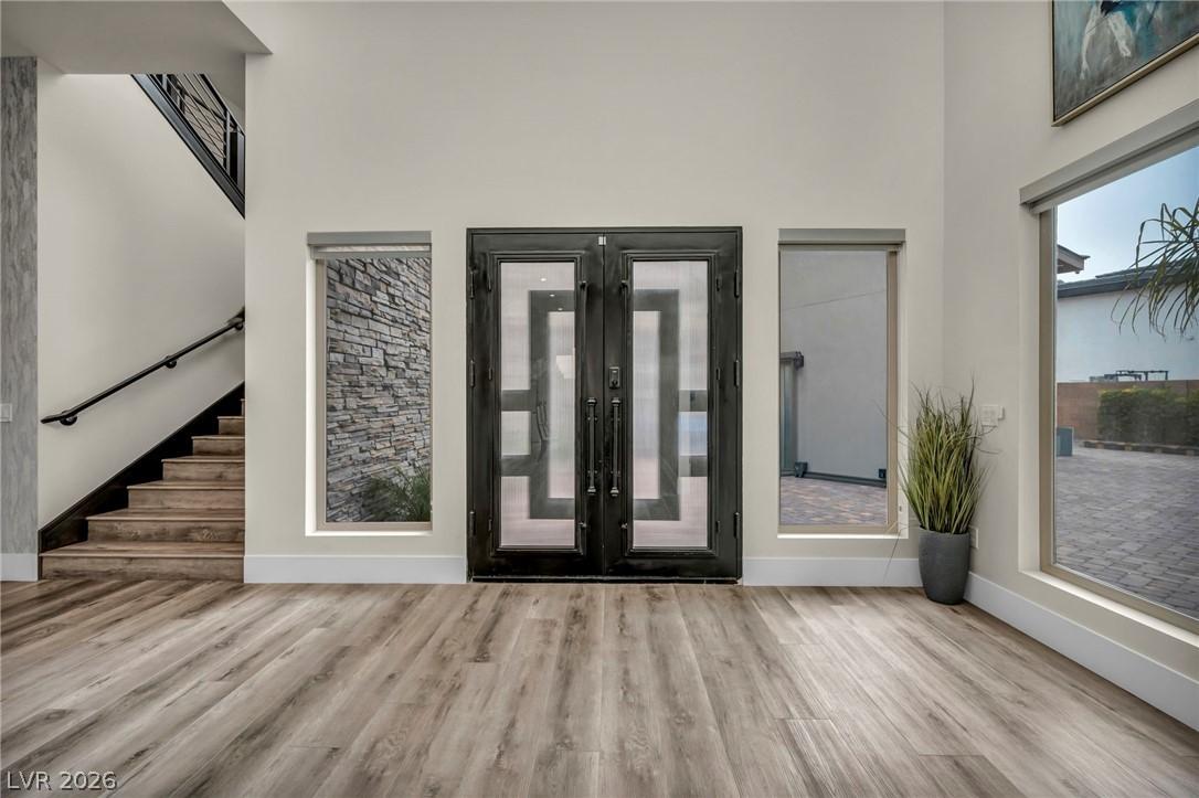 Image 4: Entrance foyer featuring french doors, wood finish