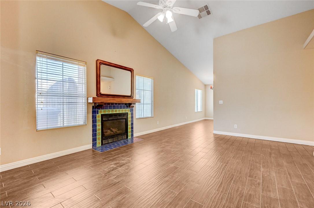Image 3: A striking fireplace with colorful tile accents an