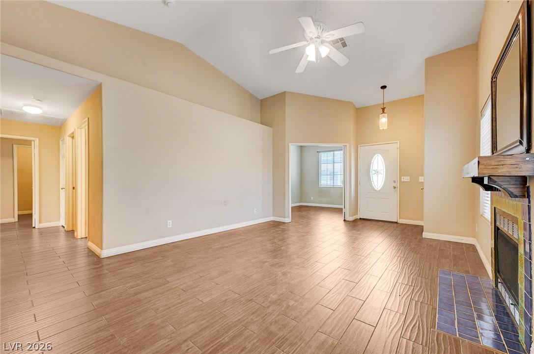 Image 4: A spacious common area with vaulted ceilings and b