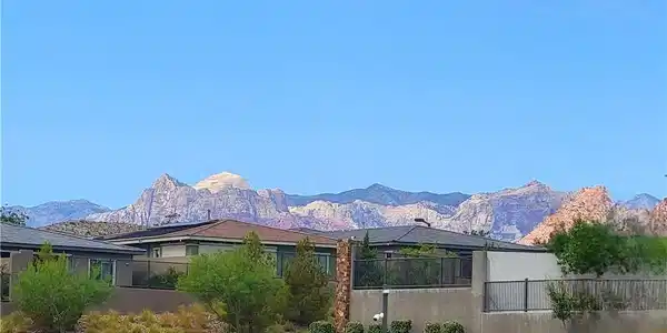 Image 3: Dramatic mountain views provide a breathtaking bac