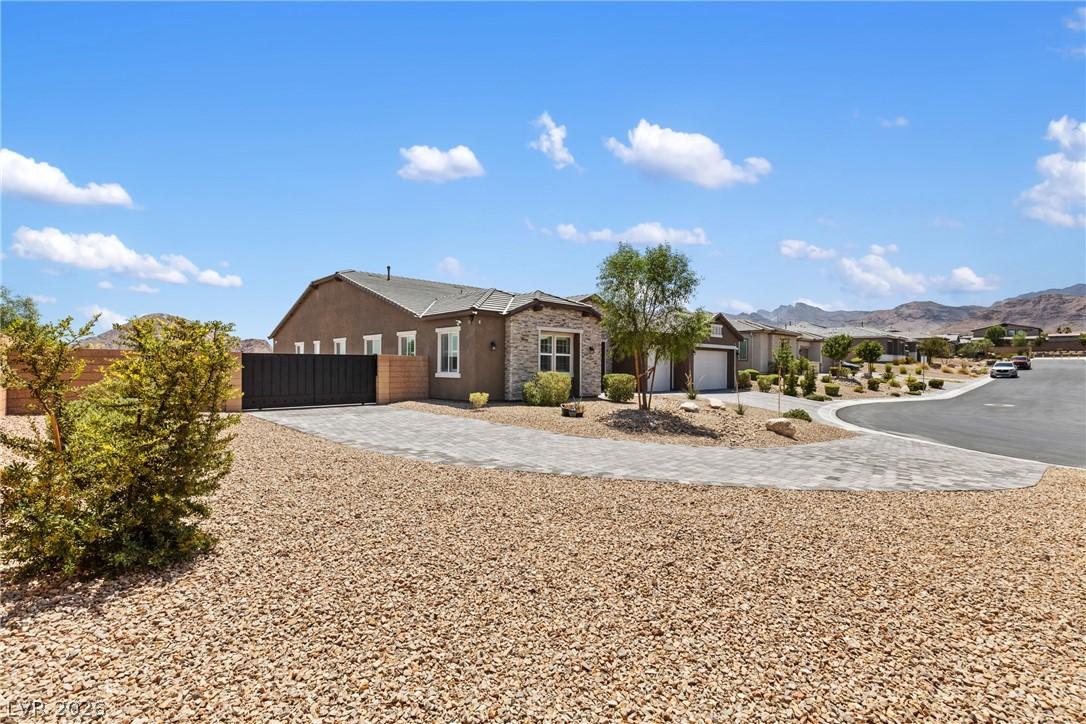 Image 2: A well-maintained cul-de-sac home features a stone