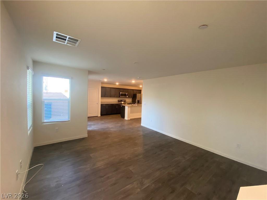 Image 4: An open floorplan seamlessly connects the well-lit