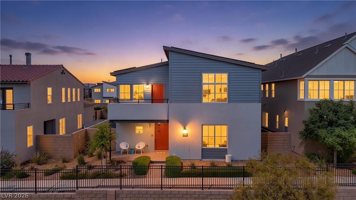 Image 2: Modern architecture with a vibrant orange front do
