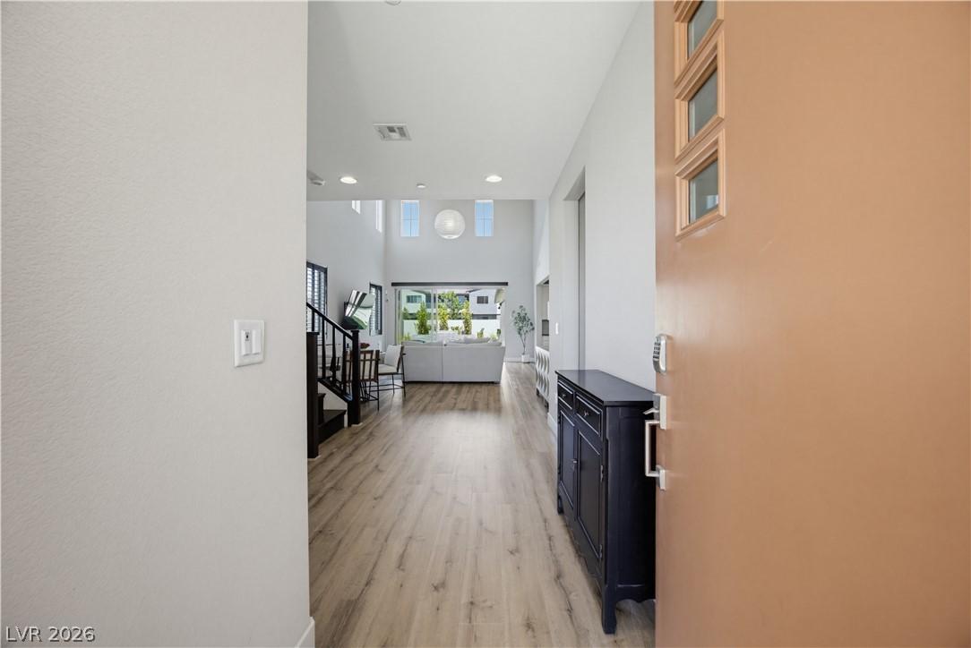 Image 4: Upon entering, find a welcoming, luminous entryway