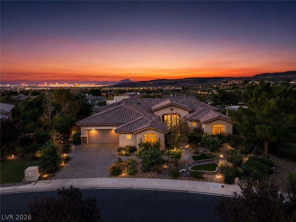 Image 2: An exquisite property under a dramatic twilight sk