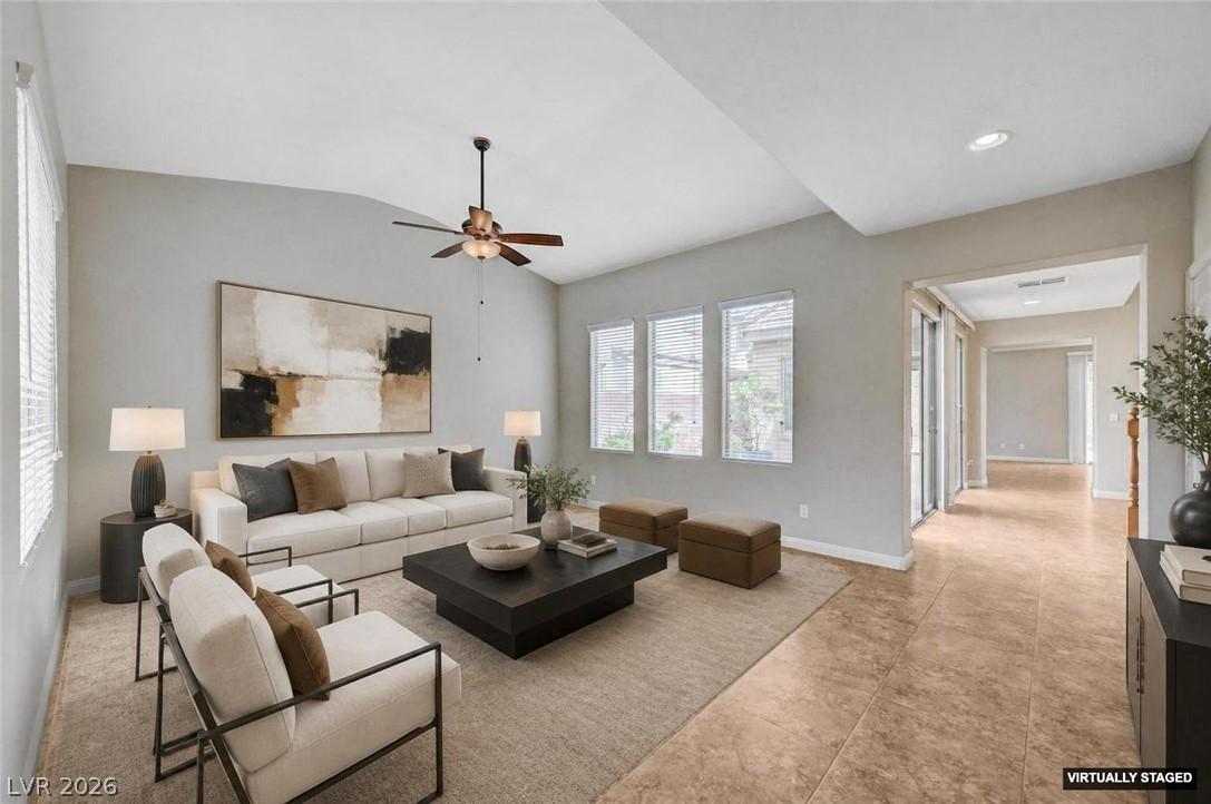 Image 2: Step into a sun-filled living area featuring vault