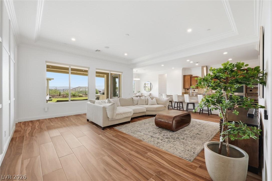 Image 2: Hardwood floors flow through this light-filled gre