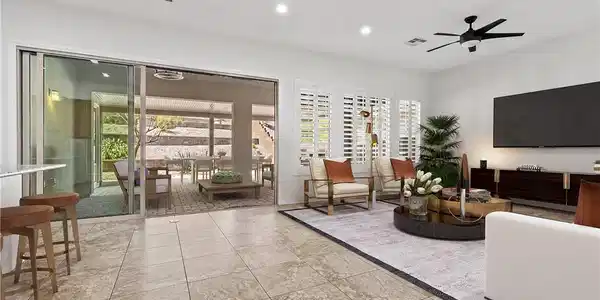 Image 4: Sliding glass doors open to an inviting outdoor li