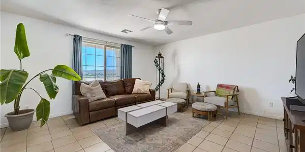 Image 3: A desert oasis with a spacious front yard and conv