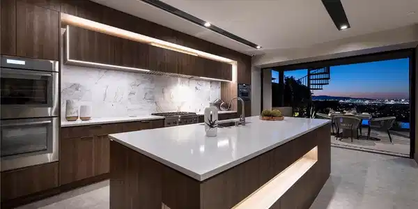 Image 4: An illuminated pool and patio offer an unrivaled v
